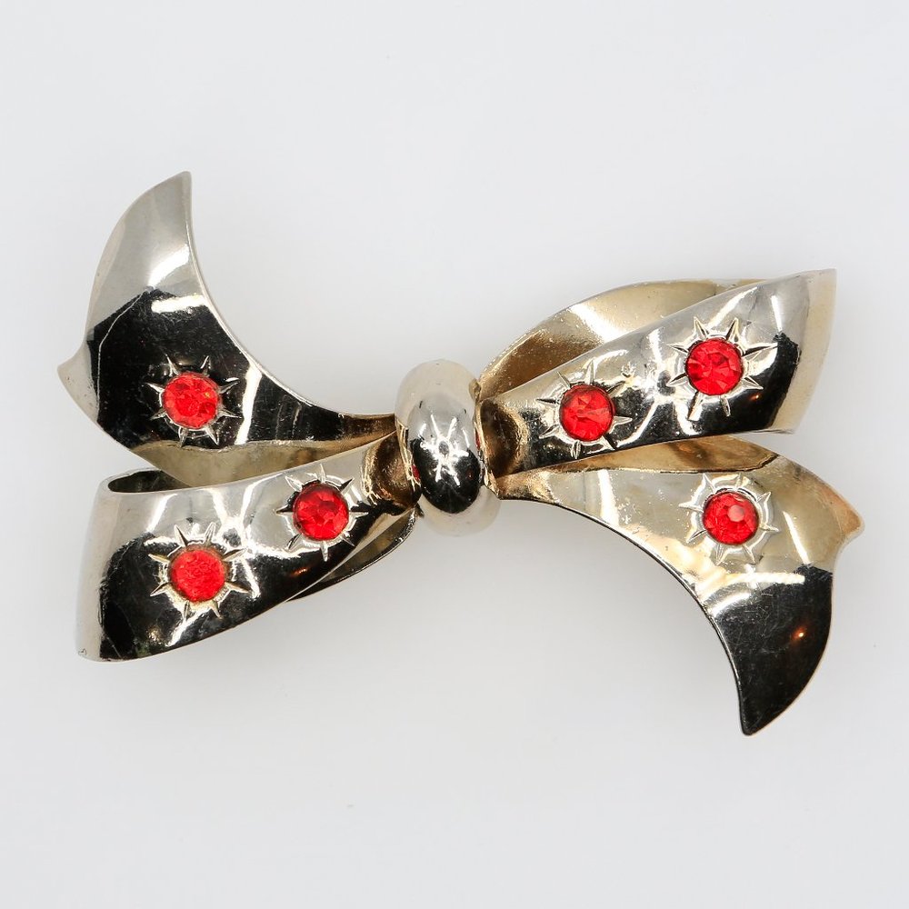 Vintage Natalie Art Moderne Silver Tone Bow Brooch With Orange Rhinestones 1940s